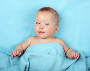 Newborn baby on blue blanket