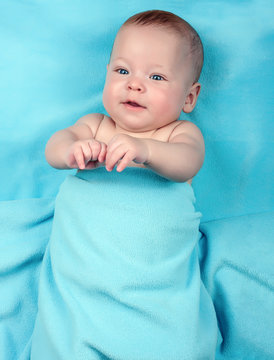 Newborn Baby On Blue Blanket