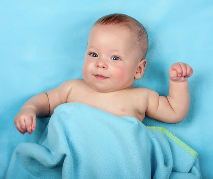 Newborn Baby On Blue Blanket