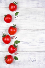 tomatoes on white wooden table top view