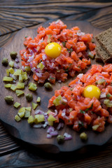 Close-up of salmon tartare, selective focus, studio shot