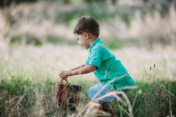 a little boy with a suitcase