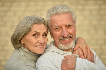 Mature couple near wall