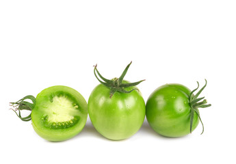 Green tomatoes isolated on white background