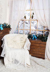 White arm-chair near the window