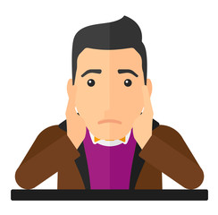 Man clutching his head in desperate.