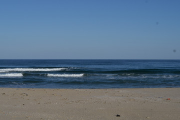 Fototapeta na wymiar Ocean waves lapping on the beach autumn