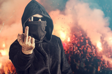 Angry hooligan showing the middle finger - obrazy, fototapety, plakaty
