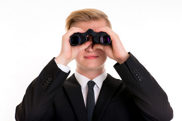 business man is looking through binoculars