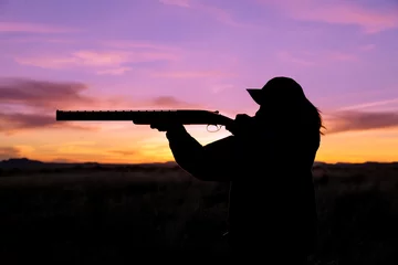 Poster Chasser Hunter Silhouetted at Sunset