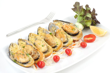 Grilled mussels with cheese and cherry tomatoes isolated on white