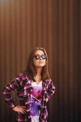 Obraz premium Fashion portrait of pretty young hipster woman in glasses