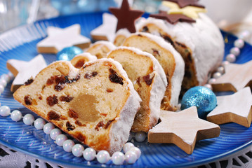 sliced christmas stollen cake on blue plate