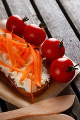 Bread with fresh cheese on rustic table