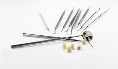 Metal ceramic dentures with dentist tools