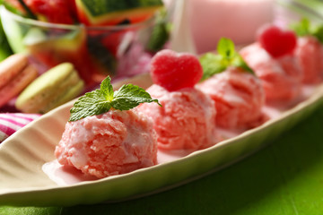 Watermelon ice cream in bowl  on color wooden background
