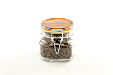 roasted coffee beans in glass bottle
