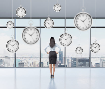 businesswoman thinking about time, pocket watch hovering above