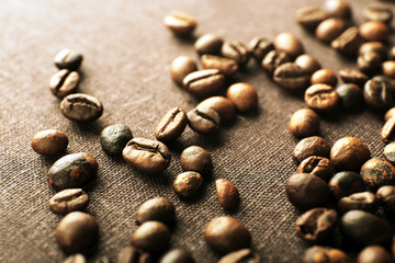 Fototapeta na wymiar Roasted coffee grains, close-up