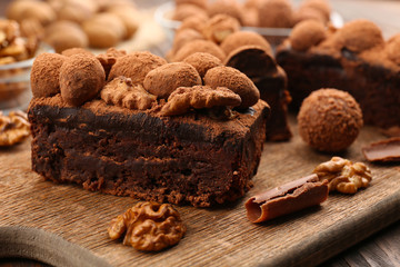 Pieces of chocolate cake with walnut on the table, close-up