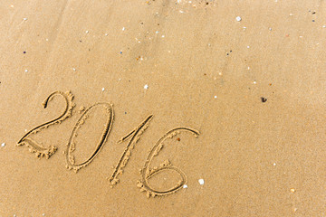 2016 Year written on the beach sand