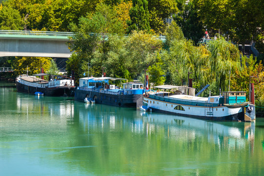 View of houseboats on the river in Lyon, France