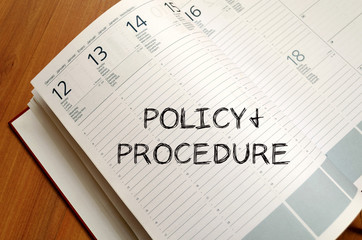Policy and procedure write on notebook