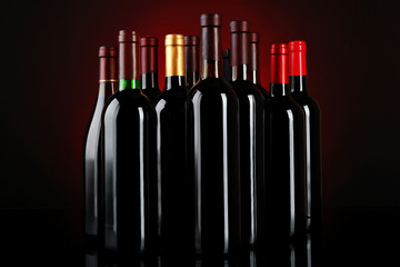 Wine bottles on red background