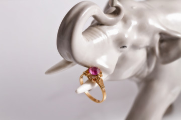 Porcelain figurine of an elephant with a silver ring