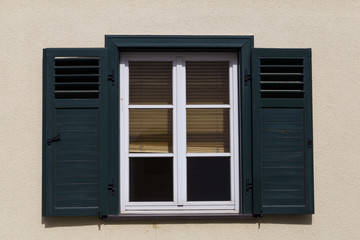 window with wooden shutters