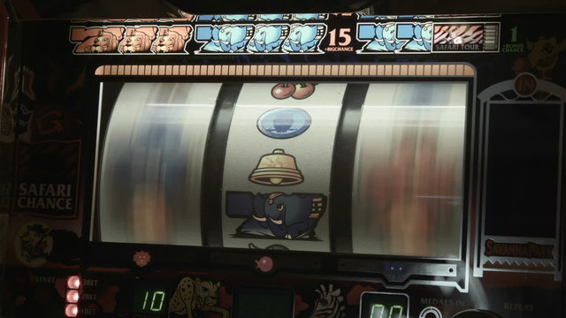 Retro vintage slot machine close up playing losing