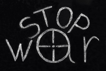 STOP war word written on a blackboard