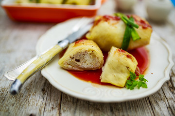Stuffed cabbage with meat and rice in tomato sauce
