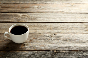 Cup of coffee on a grey wooden table
