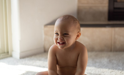 Toddler boy laughing