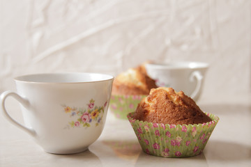 delicious lemon muffins with tea and coffee romantic mood