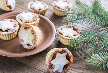 Mince pies with Christmas tree branch