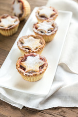 Mince pies with Christmas tree branch