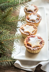 Mince pies with Christmas tree branch