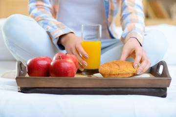 Healthy breakfast on wooden tray.