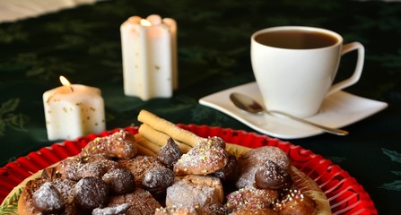 Christmas cookies with cup of black coffee decorated on a table