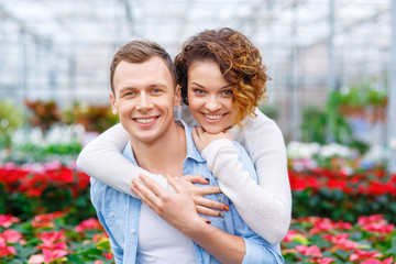 Fototapeta premium Young couple in the greenhouse.
