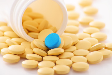 Composition with variety of drug pills and container