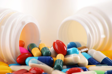 Composition with variety of drug pills and container