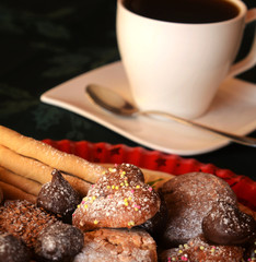 Christmas cookies with cup of black coffee decorated on a table