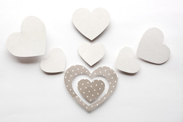 White and gray hearts on white paper  background