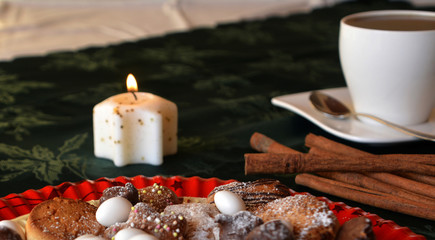 Christmas cookies with cup of black coffee decorated on a table