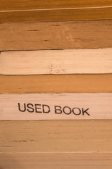 Paper texture of close composition of stack of well worn used books