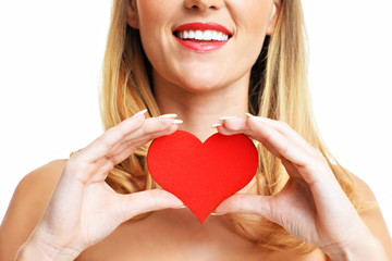 Sexy Valentine woman holding a heart