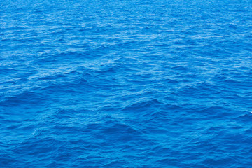 Blue sea surface with waves